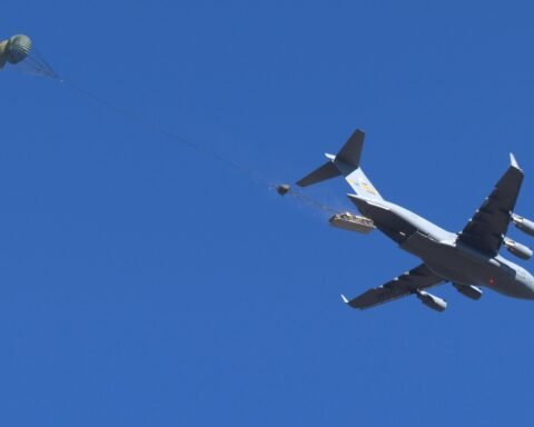 An M1093A2 Family of Medium Tactical Vehicle deploys out of a U.S. Air Force C-17 Aircraft at Fort Liberty, North Carolina during Low Velocity Airdrop testing. (Mr. Chris O’Leary, Airborne Special Operations Test Directorate, U.S. Army Operational Test Command)